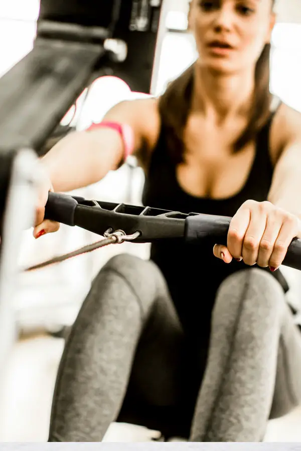 woman using a rowing machine