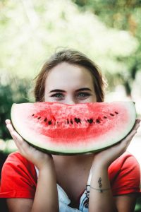 healthy-woman-eating-a-watermelon
